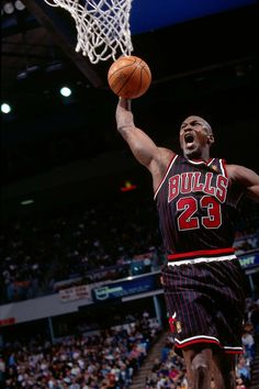 a basketball player dunking the ball into the hoop