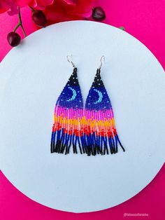 These beautiful beaded earrings are so colorful and perfect for all-day wear. They are definitely the perfect accessory to style up your look and add personality to your outfit. These lovely handmade earrings are made with sterling silver hooks and colorful beads. Each pair of earrings that we sell is authentic and one-of-a-kind! Finds more styles at https://www.etsy.com/shop/LatinxsCulturaViva?ref=simple-shop-header-name&listing_id=990207426&section_id=26730499 Thank you so much for vis Multicolor Whimsical Earrings, Whimsical Multicolor Festival Earrings, Artistic Multicolor Round Bead Earrings, Unique Multicolor Beaded Earrings As Gift, Artsy Blue Beaded Dangle Earrings, Blue Artsy Beaded Dangle Earrings, Artsy Multicolor Round Bead Earrings, Adjustable Multicolor Whimsical Flower Earrings, Multicolor Chandelier Earrings With Ear Wire As Gift