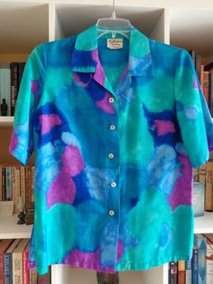 1960's Ladies Hawaiian Print Blouse by Sun Fashions of Hawaii/ Honolulu Multicolor Blue, Green and Purple Abstract Design 7 Inch Side Splits 5 Front Buttons Barkcloth Cotton SIZE: Large MEASUREMENTS (in inches): Shoulder to Shoulder (back): 16 Bust: 40 Side Length (armpit to hem): 18 Arm Length (armpit to cuff): 8 Neck Opening: 16 Neck to Hem (back): 27 INTERNATIONAL CUSTOMER?? Please email for Shipping Info Lisa Nichols, Hawaii Honolulu, Fashion 1960s, Blue Hawaiian, Purple Abstract, Side Splits, Hawaiian Print, May 13, Print Blouse