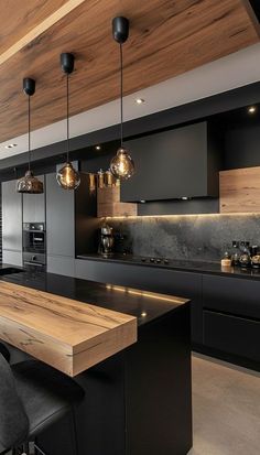 a modern kitchen with black cabinets and wooden counter tops, along with bar stools