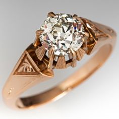 an antique diamond engagement ring in yellow gold