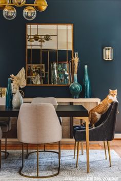 an orange and white cat sitting on top of a dining room table