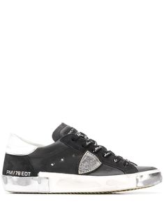 Black leather low-top sneakers from Philippe Model Paris featuring a front lace up detail, a silver-tone logo plaque, a white rubber sole, a round toe and a distressed finish. Metallic Flats, Philippe Model, Black Friday Promotions, Sneaker Wedge, Low Sneakers, Tory Burch Shoes, Manolo Blahnik, Luxury Shoes, Golden Goose Sneaker