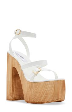 A wood-grain heel and platform play up the retro appeal of a lofty, strappy sandal embellished with a slim ankle strap. 5 3/4" heel; 2 1/4" platform Adjustable ankle strap with buckle closure Synthetic upper, lining and sole Made in Italy Sandal Women, Strappy Sandals, Platform Sandals, Shoes Women Heels, Wood Grain, Steve Madden, Ankle Strap, Womens Sandals, Grain