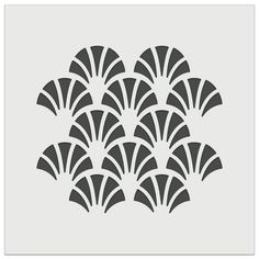 an art deco stencil with black and white fan shapes on a gray background