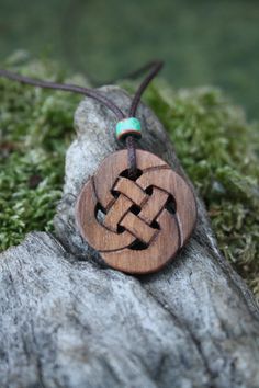 This very unique Celtic knot necklace will be hand carved for you, or a loved one, in my studio on the West of Ireland. Delicately carved, this Celtic infinity knot features a piece of Walnut, recycled from musical instruments constructed by a local luthier. As a musician myself, I take enormous satisfaction in creating a piece of jewellery whose inherent wood has previously featured in a beautiful hand-made guitar! Celtic knots date back to the 3rd to 4th century B.C. Drawn in one continuous li Rustic Carved Jewelry As Gift, Celtic Infinity Knot, Celtic Knot Necklace, Infinity Knot, Dremel Wood Carving, Genuine Love, Unique Gifts For Men, Infinity Necklace, Knot Necklace