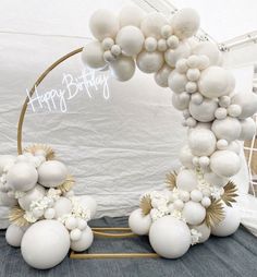 an arch made out of balloons and flowers