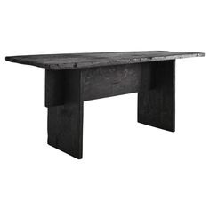 an old black table with no legs on it