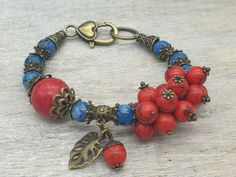 "ELFs Handmade Boho Summer Vintage Victorian style Attractive Red bamboo Coral and Blue agate natural gemstone bracelet with antique bronze textured findings and large decorative clasp. Total length 7.5\"/19cm Comes in velvet jewellery pouch. Red Bamboo Coral gemstone imparts courage and helps in overcoming fear and nervousness in the individual. This is the best gemstone, which can boost the self-esteem of the wearer. This gemstone has amazing healing effects. Agate is an excellent stone for re Handmade Bronze Beaded Bracelets As Gift, Bronze Bracelets With Natural Stones For Gift, Vintage Beaded Bracelet With Natural Stones For Gifts, Unique Bronze Beaded Bracelets As Gift, Unique Bronze Beaded Bracelets For Gift, Unique Bronze Beaded Bracelet As Gift, Red Bohemian Beaded Bracelets With Natural Stones, Red Gemstone Beaded Bracelet Bohemian Style, Bohemian Jewelry With Natural Stones And Red Coral