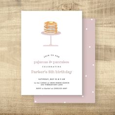 a pink and white birthday party card with a cake on the plate in front of it