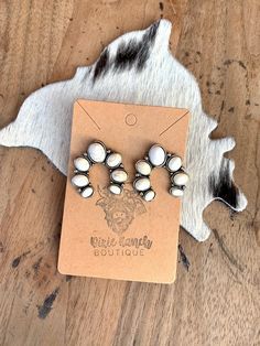 Western Concho Squashblossom Style Stud Earrings Featuring Faux Cream Stones Earrings measure 1.15inches tall , 1.10 inches wide ** Made with alloy metals Southwestern White Teardrop Earrings, Southwestern White Drop Earrings, Nickel-free White Southwestern Earrings, Western Earring, Earring Combo, Cream Stone, Stones Earrings, Faux Cowhide, Wedding Earring