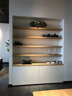 the shelves are lined with wine glasses and vases