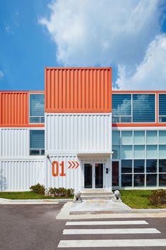 an orange and white building with the number 10 painted on it's front door