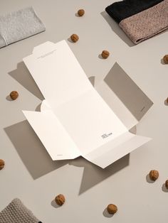 an open box sitting on top of a table next to some nuts and napkins