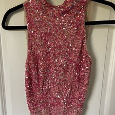 Pink Sequin High Neck Bodysuit Fitted Sleeveless Bodysuit For Party Season, Sleeveless Bodysuit For Party Season, Glamorous Sleeveless Spring Bodysuit, Pink Halter Neck Party Bodysuit, Pink Halter Neck Bodysuit For Party, Sleeveless Sequined Bodysuit For Night Out, Spring Sequined Bodysuit For Night Out, Fitted Sequin Halter Neck Tank Top, Sequin Turtleneck