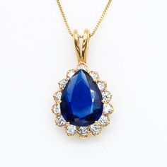 Gold Sapphire Pendant set with a created Sapphire in a flawless diamond cut & royal blue color, at 16x12mm, 10 Carats. Surrounded by top grade CZ Diamonds Teardrop Pendant made of Gold Vermeil ☞ thickest 18k Gold Plating on top of Solid 925 Sterling Silver ☞ made to last. Matching Ring: www.etsy.com/uk/listing/780193095 Matching Earrings - please ask me   Details :  ♥ Each item comes in a cute GIFT BOX ✓ ♥ GUARANTEE on the materials ✓ ♥ Created Sapphire - perfect diamond cut & tear drop shape & Blue Pear Shaped Jewelry With Prong Setting, Blue Pear-shaped Jewelry With Prong Setting, Blue Sapphire Drop Jewelry, Blue Pear Shaped Prong Set Jewelry, Blue Drop Jewelry With Diamond Accents, Blue Pear-shaped Diamond Jewelry, Pear-shaped Blue Diamond Jewelry, Blue Pear-shaped Diamond Necklace, Blue Pear-shaped Brilliant Cut Jewelry