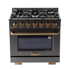 a black and gold stove with four burners on the front, and two oven doors open