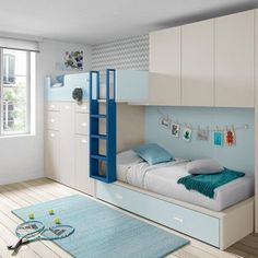 a blue and white bedroom with a bunk bed