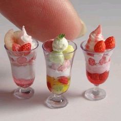 three small glasses filled with ice cream and fruit