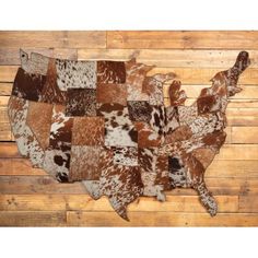 the united states made out of cowhides on wooden planks is shown in brown and white