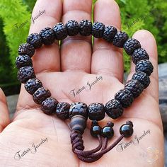 📿Natural Aged Dark Black Rudraksha Beads Adjustable Bracelet The Rudraksha beads are sanded in a tumbler for comfort before being naturally stained and oiled to achieve their beautiful dark color and aged appearance. The natural and sustainable seed beads have amazing texture and visual appeal.  Bead Size - 8.0 - 9.0MM 🪔Length - 7.5 Inches (Adjustable to 1 Inch) 📿 Rudraksha Beads 📿 ✨🪵Peace ✨ Concentration ✨ Protection ✨Spiritual Evolution ✨ Mental Clarity  Rudraksha beads are known for their healing properties and protective powers.  By meditating with a rudraksha mala, it is believed to increase the ability to concentrate, giving clarity and peace of mind.  Their size and texture make them great for promoting concentration during meditation. These beads are said to be very powerful a Protection Spiritual, Spiritual Evolution, Rudraksha Mala, Rudraksha Beads, Wrist Mala, Yoga Bracelet, Yoga Gifts, Healing Bracelets, Mental Clarity