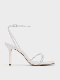 Amp up the glamour with these sandals. The elegant strappy design is rendered in a clean white satin finish to create a timeless silhouette. To add eye-catching sparkle, crystal embellishments adorn the straps and elevates the breathable open-toed style sandals. Set on slender stiletto heels, these will accentuate your feet and elongate the frame, making them the perfect statement sandals for festive occasions and upscale functions. White Heels Prom, White Glitter Heels, Grad Shoes, Glittery Sandals, White Stiletto Heels, Statement Sandals, Heels Prom, Sparkle Heels, Frame Making