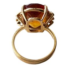 This classic 18K gold ring masterfully displays a magnificent Imperial Citrine quartz crafted in the shape of a large 06.2" x 0.5" x 0.3", weighing 6.5 grams. Size 6, ring size 1" h by 0.75" w by 0.50 " d The stone is set in a center prong style for eye-catching brilliance. This exquisite piece of jewelry is an ideal addition to any fine jewelry collection and provides excellent style and luxury. Citrine is more than just a beautiful gemstone; it carries a wealth of symbolism and cultural signif Formal Yellow Gold Cabochon Sapphire Ring, Formal Cabochon Ruby Ring, Collectible Gold Opal Ring With Gemstone, Formal Round Citrine Crystal Ring, Collectible Gold Opal Gemstone Ring, Formal Citrine Crystal Round Ring, Gold Crystal Ring With Polished Finish For Formal Occasions, Formal Citrine Crystal Ring, Luxury Amber Rings For Formal Occasions