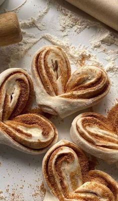 cinnamon rolls are arranged on a baking sheet