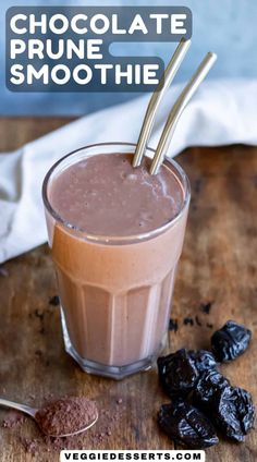 chocolate prune smoothie in a glass with two straws