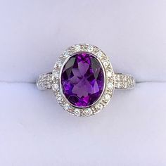 This Gorgeous Nwot 14kw, Genuine (8x10mm, 2.15ct.) Oval Amethyst Ring, Is Surrounded By .07ctw Of Pave Diamonds Both Around The Amethyst & Down The Side Of The Band, The Band Width Measures 3.4mm Wide At The Top Side Down To 2.5mm At The Bottom Center, Size 5 Oval Platinum Gemstone With Center Stone, Classic Oval Gemstones With Halo Setting, White Gold Oval Gemstones Fine Jewelry, Luxury Oval Amethyst Platinum Ring, Classic Oval Platinum Gemstones, Oval Hallmarked Amethyst Ring In White Gold, Platinum Amethyst Ring In White Gold, Oval Brilliant Cut Amethyst Ring In Fine Jewelry Style, Oval Amethyst Ring In White Gold For Formal Occasions