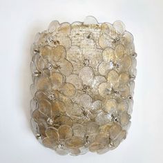 a decorative glass bowl on a white wall