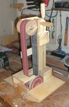 a woodworking machine sitting on top of a wooden table