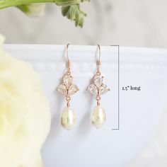 Sophisticated and elegant, The Rose Earrings in Rose Gold, are the perfect complement to summer weddings. Dress your bridesmaids in simple glamour with earrings that can be worn long after your wedding day. Size: 1.5" long Materials: cubic zirconia, Swarovski pearls in white Metals: rose gold filled ear wires and components, rose gold plated links Find the matching necklace here Elegant Rose Gold Teardrop Linear Earrings, Elegant Rose Design Earrings For Wedding, Elegant Rose Design Wedding Earrings, Classic Rose Gold Bridal Earrings For Wedding, Rose Gold Dangle Linear Earrings For Wedding, Delicate Rose Gold Crystal Earrings For Wedding, Elegant Rose Design Drop Earrings, Rose Gold Rose Design Wedding Earrings, Elegant Rose Gold Bridesmaid Earrings