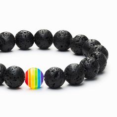 This bracelet is finished with a single rainbow bead to represent peace and growth. The rainbow teaches us to embrace our own differences and the differences of those around us. Each individual color is beautiful on its own and collectively they create a stunning visual that reminds us of endless possibilities and courage to welcome our full potential. The lava stone also known as “basalt” is a porous volcanic rock has been solidified from molten lava after conditions of intense heat and pressur Casual Rainbow Bracelets With 8mm Beads, Spiritual Rainbow Beaded Friendship Bracelets, Rainbow Round Bead Bracelets For Meditation, Multicolor Bracelets For Pride Gift, Multicolor Bracelets For Pride, Multicolor Pride Bracelets As A Gift, Multicolor Pride Bracelets For Gift, Spiritual Rainbow Bracelets For Friendship, Adjustable Rainbow Bracelets With 8mm Beads