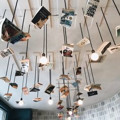 many books are hanging from the ceiling