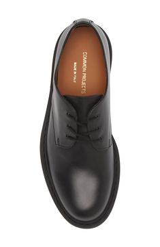 A plain toe enhances the sleek look of an ultrasmooth leather derby crafted in Italy and branded by a foiled logo at the heel. Lace-up style Leather upper and lining/rubber sole Made in Italy Designer Shoes Common Projects, Sleek Look, Shoes Men, Up Styles, Designer Shoes, Derby, Rubber Sole, Dress Shoes Men, Shoes Mens