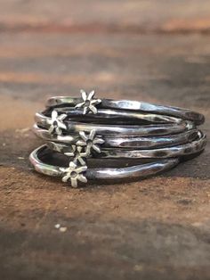 A lovely stack of artisanal star rings make a fun and unique gift for her! or yourself lol. ✨✨ Dainty, Vintage style, sweetheart of ring can be worn as a single or wear as a stack ring with several others! (Adorable either way!) These are cute lil rings! Please check photos for size comparison. They are meant to be dainty.  Made of Sterling silver (925) Christmas gift, Birthday gift, Boho gift, hippie gift for those you love! Handmade, as is all of the jewelry in my store. Artisanal, Bohemian st Silver Star Ring, Bohemian Vintage Style, Hippie Rings, Hammered Silver Ring, Sterling Silver Stacking Rings, Hippy Gifts, Stack Ring, Ring Stack, Statement Ring Silver