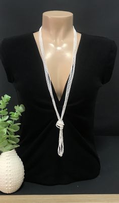 "This is a pearl beaded long necklace that measures about 44 inches long in total . The knot is adjustable, simple to undo and redo at the height you would like! Or you can wear the necklace double up without any knot! It is a very versatile necklace that can be adapted to your taste.   ❤ PROCESSING AND SHIPPING Most orders are made and shipped out in one business day. Please check delivery timeframes for your location on the description below.  ❤ CUSTOM ORDERS If you like this item in a different color, send me a message indicating: color, size and quantity needed. I will send you a link for a \"custom order\" and you'll be able to place the order there.  If you like this item with some variations such as thickness or style, please also send me a message and I will work with you! Go back Long Pearl Necklace Outfit, Pearl Necklace Outfit, Long Pearl Necklace, Beaded Scarf, Necklace Outfit, Long Pearl Necklaces, Scarf Necklace, Etsy Bridesmaid Gifts, Long Beaded Necklace