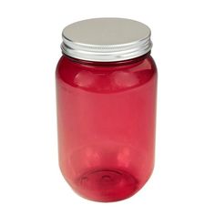 a red glass jar with a silver lid on a white background for use as a storage container