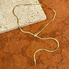 14KT yellow gold solid serpent/ snake head clasp herringbone chain necklace. Serpent head clasp is adjustable to clasp on any part of the chain! Wear as a choker lariat style or wear long! Length: 18" Weight: 9.55 grams Stamped 14K on clasp Solid Clasp measures: 5.3 x 13.9 x 2.7mm Adjustable Snake Chain Necklace For Formal Occasions, Adjustable Yellow Gold Snake Chain Necklace, Adjustable Gold-tone Snake Chain Necklace, Elegant Adjustable Snake Shape Necklaces, Elegant Adjustable Snake Shape Necklace, Adjustable Herringbone Snake Chain Necklace, Snake Shape Necklace With Adjustable Chain, Serpent Snake, Chain Necklace