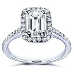 an emerald - cut diamond ring with halos and pave diamonds on the band