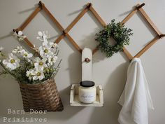 a towel rack and some flowers on a wall