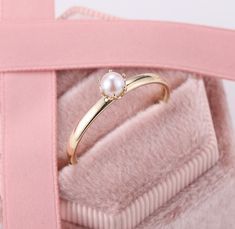 Akoya Pearl Crown Ring, Vintage Pearl Engagement Rings, Dainty Real Pearl Ring, Princess Tiara Promise Rings, Single Pearl Casual Rings ✧･ﾟ: *✧･ﾟ:* Welcome to Charles Davin Jewelry*:･ﾟ･ﾟ✧ ✶Material: 10K/ 14K/ 18K ✶Main Stone: Natural Akoya Pearl; 4mm ✶Side Stone: - ✶Width of band: 1.6mm ✶Thickness of band: 1.2mm PRODUCTION TIME My team of jewelry artisans and I are ecstatic and cannot wait to share our passion, joy and creativity with you! Our jewelry are completely crafted by hand from scratch Elegant Couple Rings With Prong Setting, Elegant Couple Rings With Prong Setting For Gift, Fine Jewelry Pearl Ring For Anniversary, Fine Jewelry Pearl Ring With Round Band For Anniversary, Anniversary Pearl Ring With Round Band, Fine Jewelry Round Cut Pearl Promise Ring, Diamond Solitaire Pearl Ring Gift, Round Pearl Promise Ring With Prong Setting, Yellow Gold Birthstone Pearl Ring