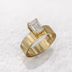 a gold ring with a diamond on it