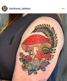 a woman with a mushroom tattoo on her arm