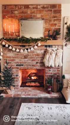 a fireplace decorated for christmas with stockings hanging from the mantle