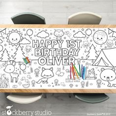 a happy 1st birthday coloring page on a table with markers and crayon pencils