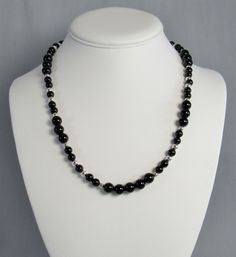 Highly polished black onyx that will add sleek sophistication to your everyday style. This natural stone and sterling silver necklace has 6mm and 8mm black gemstone beads with 4mm and 5mm sterling silver beads. It has a sterling spring ring clasp and is available in two lengths. Choose 16 inch or 20 inch -- or maybe you should get both to create a layered statement. This necklace and all KBeadsIt jewelry ships free with USPS first class domestic package service. The bracelet and earrings are sol Necklace Elegant, Buy Bead, Natural Stone Jewelry, Black Polish, Everyday Necklace, Swarovski Crystal Earrings, Onyx Bead, Black Necklace, Sterling Silver Bead