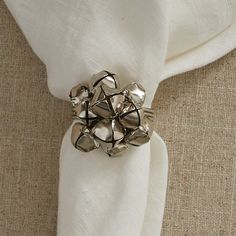 a napkin with silver rings on top of it