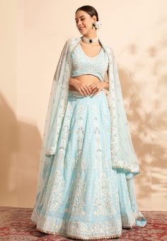 Sky blue georgette readymade lehenga choli 11006  Desc:  Style : A Line Lehenga Choli Color : Sky Blue Fabric : Georgette Work : Embroidery   Sequence Wash Care : Dry clean Sleeve Style : Sleeveless Long Sleeves : Done only in Custom Stitch Sleeves Lining : Done only in Custom Stitch Bust Size : 36 to 42 Inches Occasion : Wedding   Mehendi   Sangeet   Engagement   Reception   Ceremonial   Baby Shower. With Express Free Shipping and Custom Stitching, Buy Lehenga - Indian Party wedding and bridal  Sky blue georgette readymade lehenga choli 11006 online in USA, UK and Canada from KollyBollyEthnics.com Baby Blue Lehenga, Lehenga For Haldi Ceremony, Lehenga For Haldi, Blue Bridal Lehenga, Sky Blue Lehenga, Cyan Colour, Party Wear Lehenga Choli, Blue Lehenga, Patiala Salwar